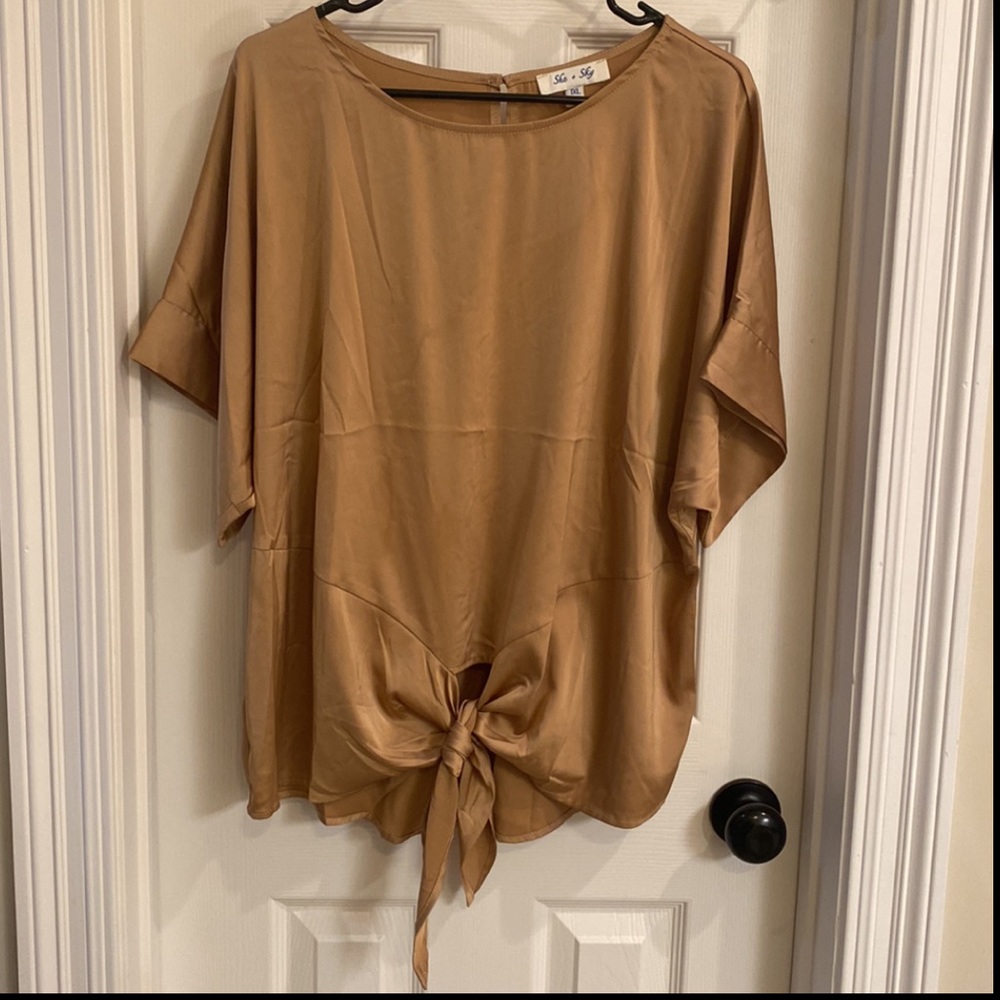 Never worn. Satin type material.